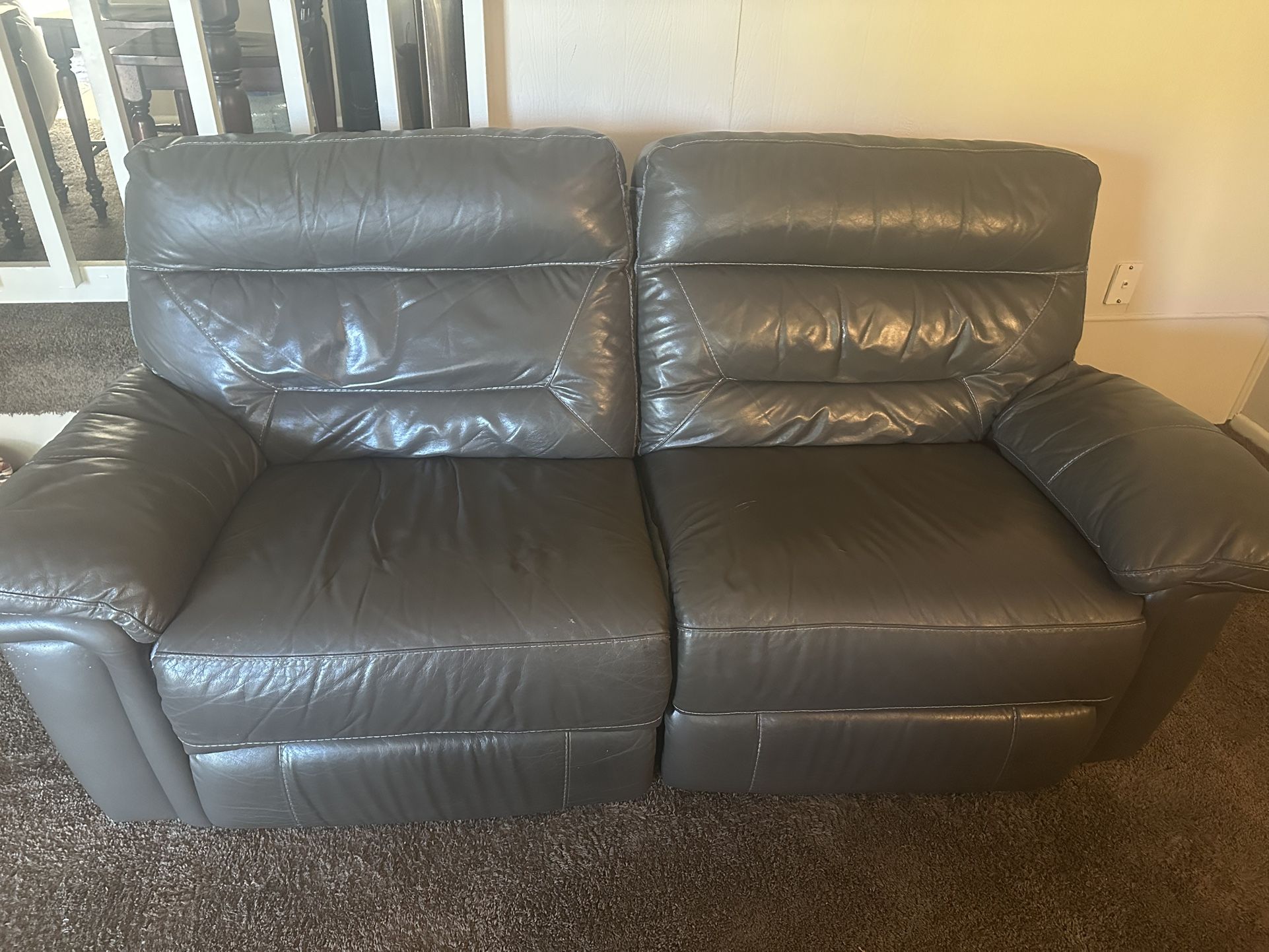 Gray leather Love seat