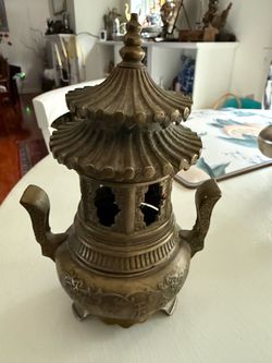 Chinese Style Incense Burner Beautiful 8 inch decorative Chinese style incense burner featuring an ornate pagoda design, detailed metalwork, and trad