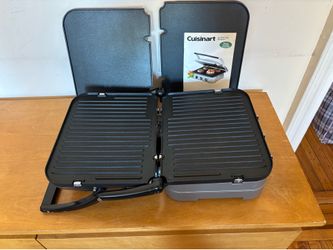 a Cuisinart Griddler 5-in-1 Indoor Grill & Griddle (Model GR-4). It is a highly popular, versatile countertop appliance featuring a brushed stainless