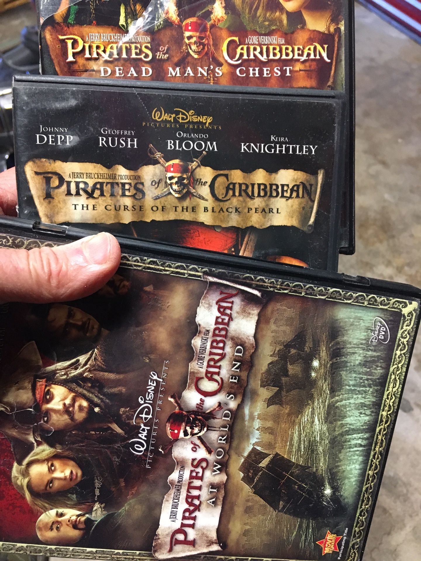 Three DVDs: Pirates of the Caribbean