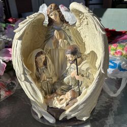 Angel With Mary, Joseph And Baby Jesus Statue