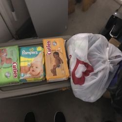 Diapers In Package And Bag Of Loose Diapers 