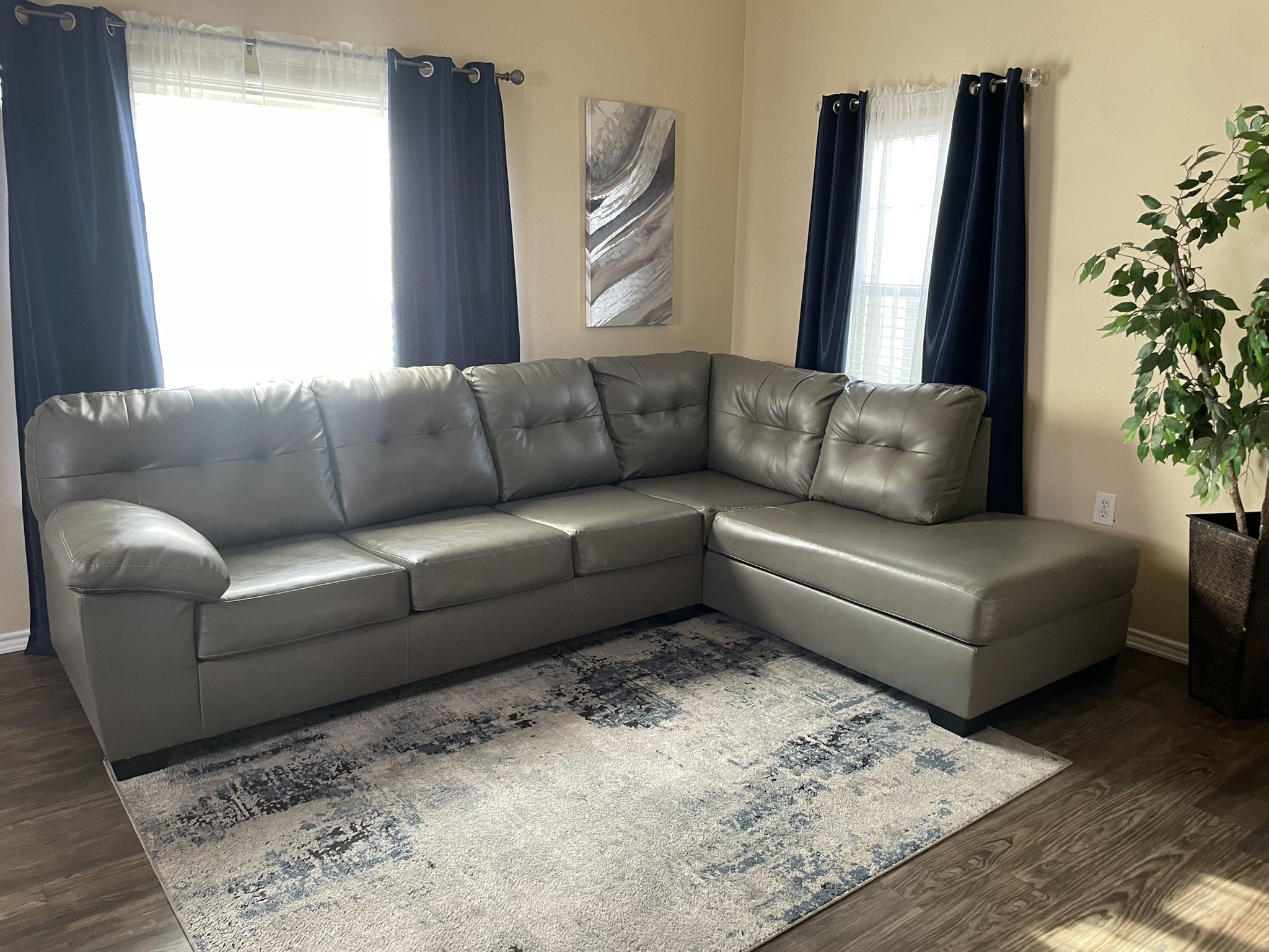 Grey Leather Sectional/rug /curtains