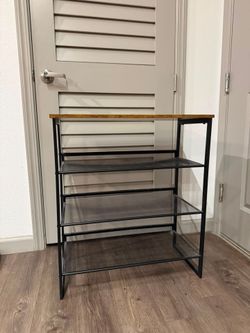 4 - Tier steel shoe rack with spacious top