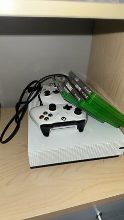 Xbox one S both controllers, charger, and 4 games also