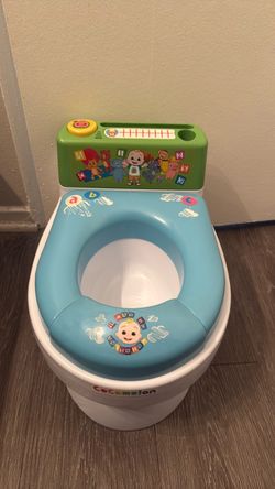 CoComelon Toddler Musical Transition Potty Trainer - Singing Potty Toilet Plays 4 Song Verses, Removable Seat Fits Standard Seats, Built In Handles, S