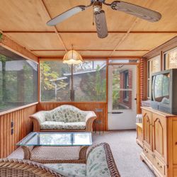 Two Resin Wicker and Glass Top Resin Wicker Coffee Table