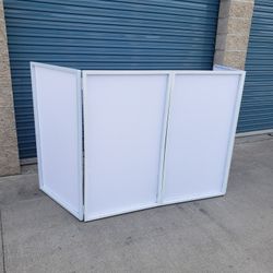 White Facade With Carry On Bag