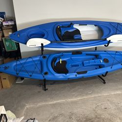 2 kayaks with paddles + kayaks stand rack