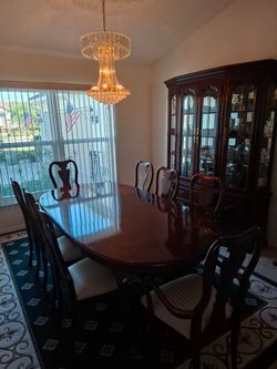Dining Room Set by Thomasville. Table with 2 leaves, and 8  chairs, and a  large beautiful china cabinet as well.