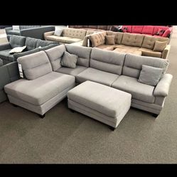 Light gray sectional with ottoman 