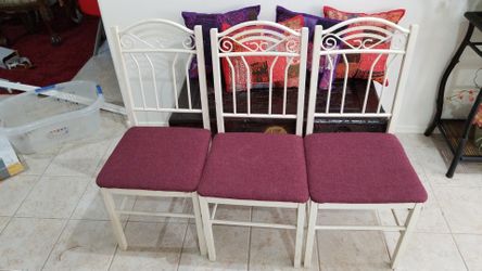 3 metallic chairs