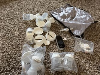 Baby buddha Breast Pump With All The Accessories In The Photo