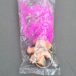 vintage Troll Doll keychain with pink hair, still in its original packaging. 