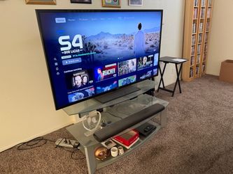 Samsung Large Flat Screen, External speakers , Dual DVD player , TV stand
