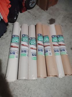 Seven 70 sheet packing paper rolls new for moving
