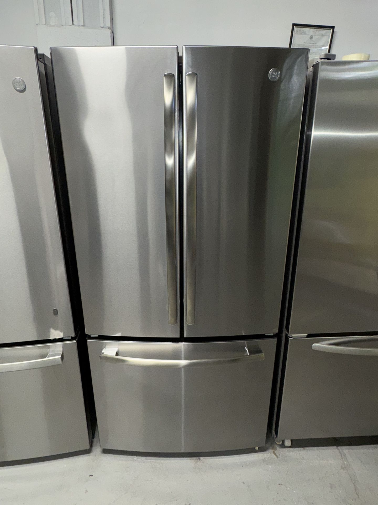 GE is a 24.8 cubic foot refrigerator with bottom freezer a receipt for 90 days warranty