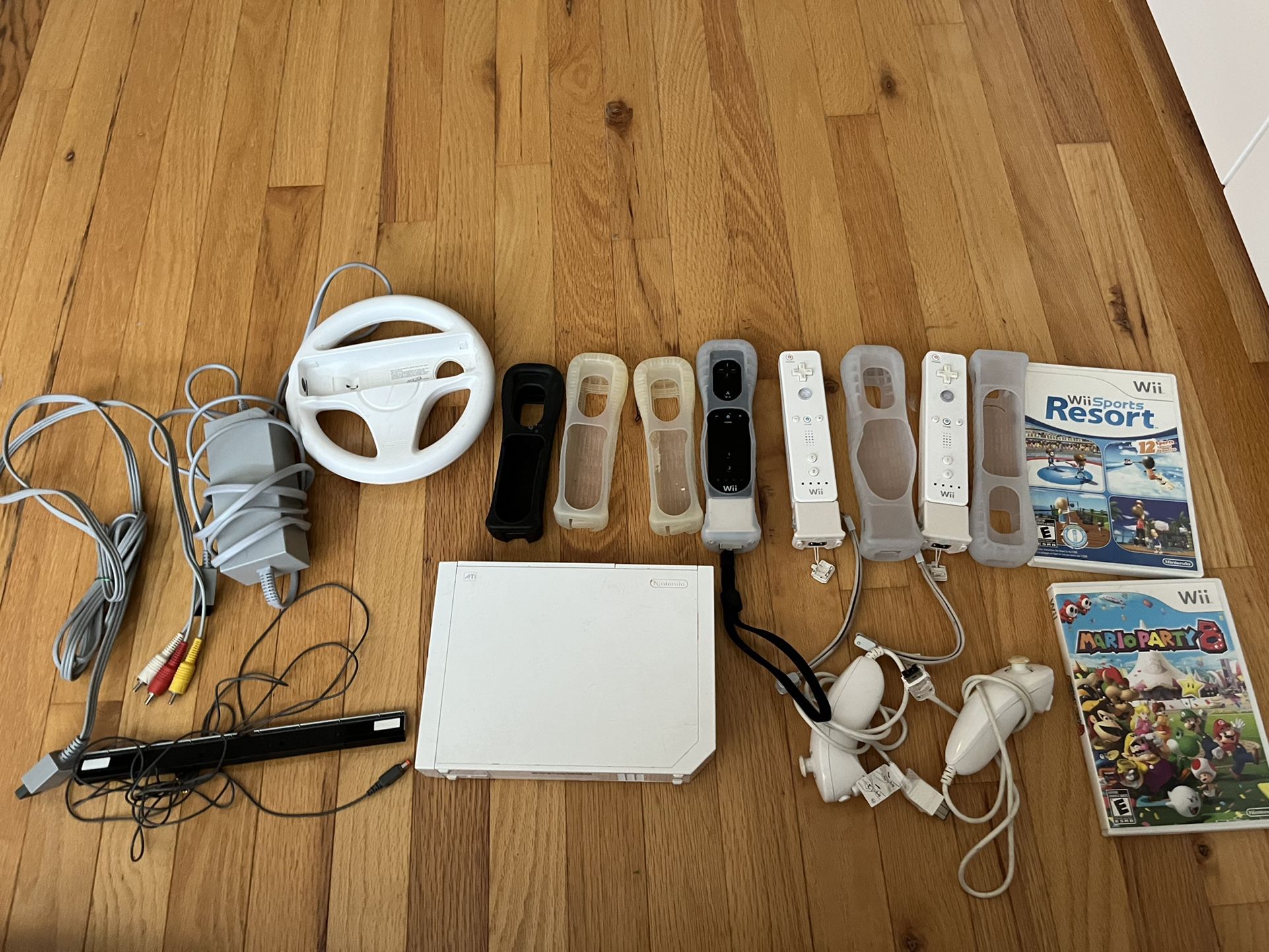 Nintendo Wii with 3 Remotes And 3 Games
