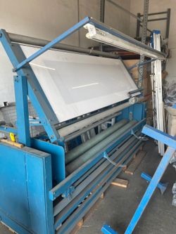 Maquina para medir y inspeccionar rollos de tela