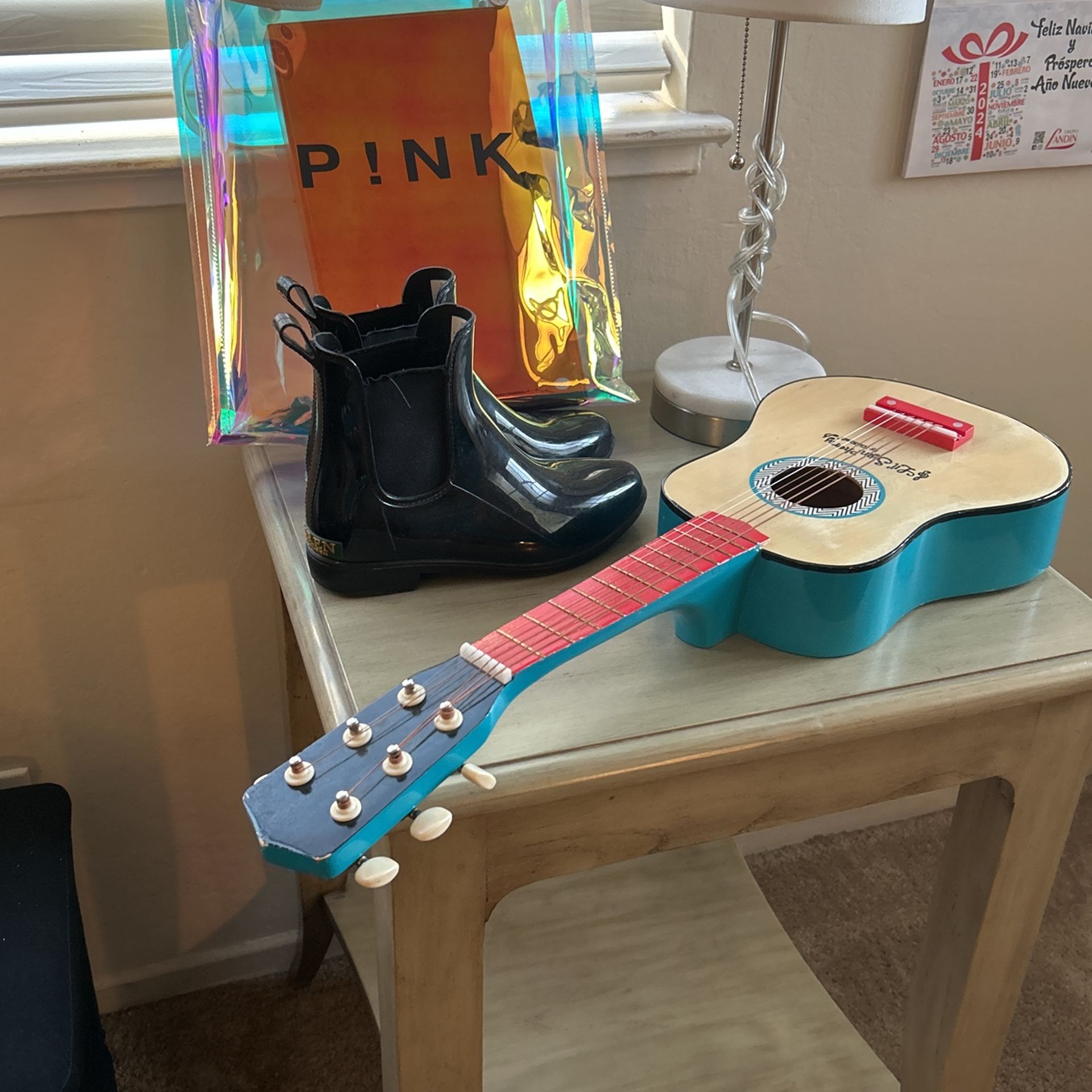 Kids Guitar . Lamp. Rain Boots . Pink Bag And Table