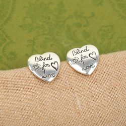 These include eyes, hearts, flowers, birds and the phrase ”Blind for Love