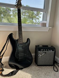 Fender Squier +bag, amp, cord, strings, assorted picks, headphones and the strap