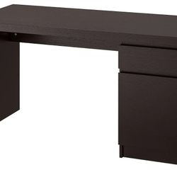 MALM desk with a rectangular top, minimalist design, and storage unit. Well-organized home office