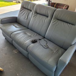 Gray Leather Reclining Sofa.