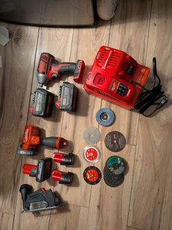 MilwaukeeM12  3 inch cut off tool and Milwaukee M18 impact drill with charger