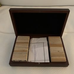 Give the gift of entertainment with this twenty eight piece domino set with wood box.