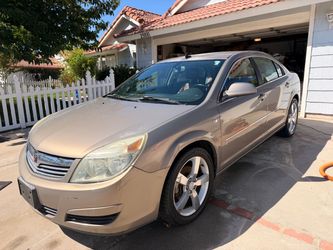 2007 Saturn Aura XE V6, 185,557 miles, automatic, gold with a brown interior, clean title