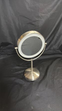 Mirror with rechargeable light