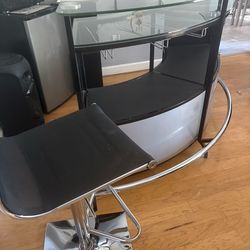 Selling a bar with four stools.