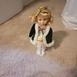 Blonde Porcelain Doll With Stand