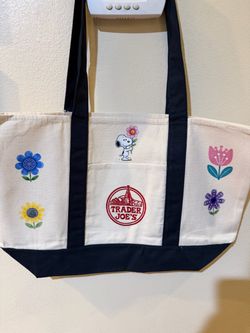 Large navy blue Trader Joe’s Tote with floral Snoopy design