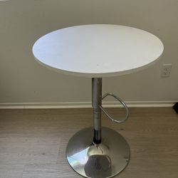 Elevating bar counter table