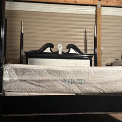 Black king size bed frame, mattresses, and boxspring