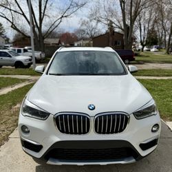 2018 White BMW X1 AWD – $13,999
