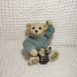 Teddy in a blue sweater figurine 5" sitting . Good condition and smoke free home. 