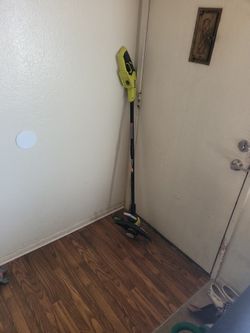 RYOBI Weed eater/ Tilts up to become an edinger. Cordless without battery.