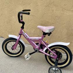Jamis laud bug pink bicycle with training wheels