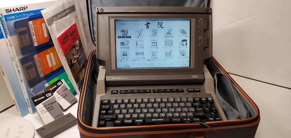 Sharp WD-A341 vintage digital printer and writer. Come with case manual cartridges.