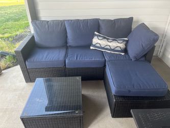 Outdoor sectional couch with cushions