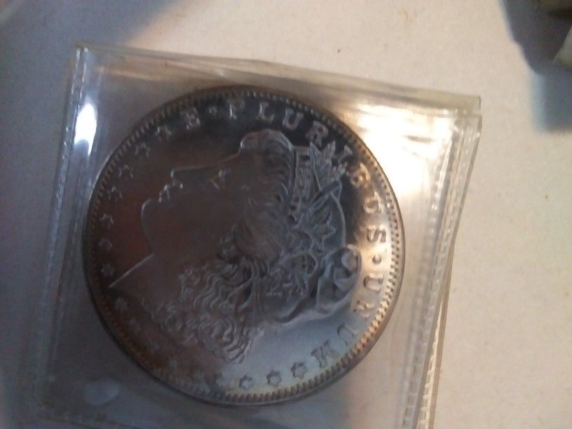 2 Morgan Silver Dollars.