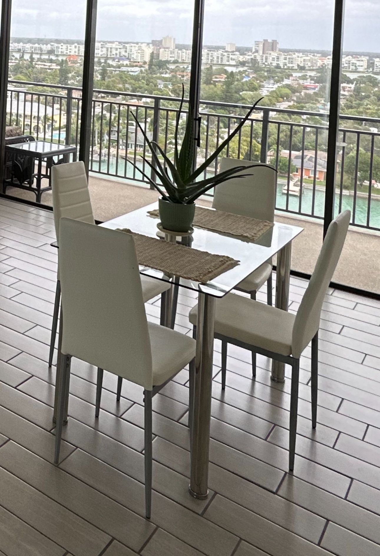 Glass Kitchen Table With Four White Chairs