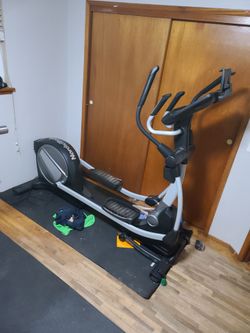 Elliptical and at home gym with around 400 in weights