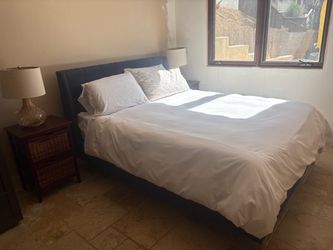 Dark Blue Upholstered Bed Frame and side tables