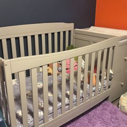Gray Crib With Changing Table And Two Drawers 