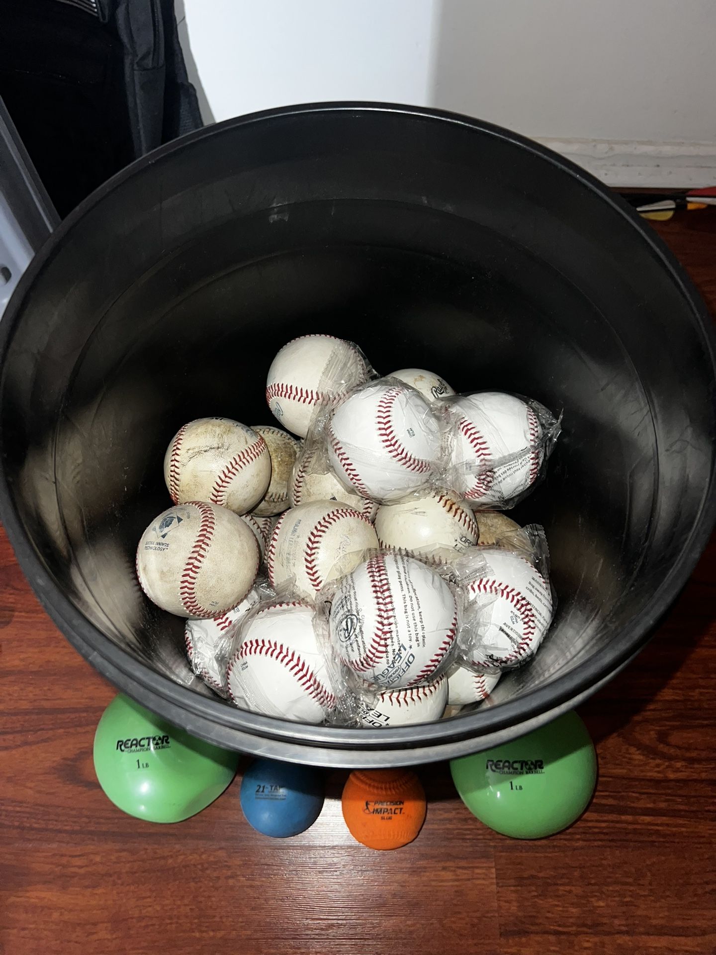Bucket Of Baseballs And Plyo Balls