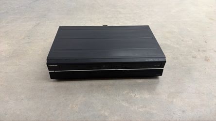 black Toshiba DVD and VCR combo recorder,